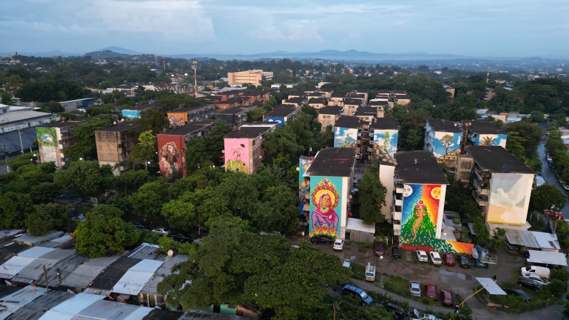 Colorful mural-lined street in Zacamil